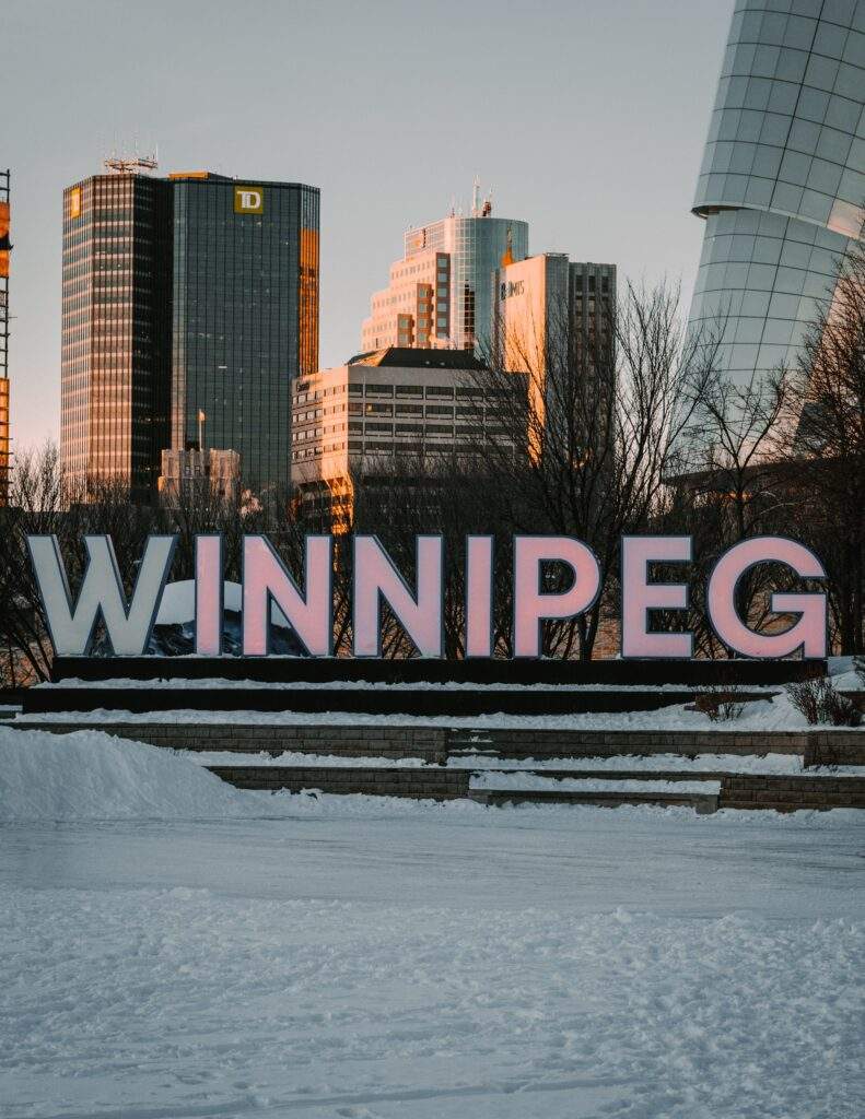 Manitoba Winnipeg Photo by Nicolás Jaramillo: https://www.pexels.com/photo/city-buildings-under-the-cloudy-sky-6297815/